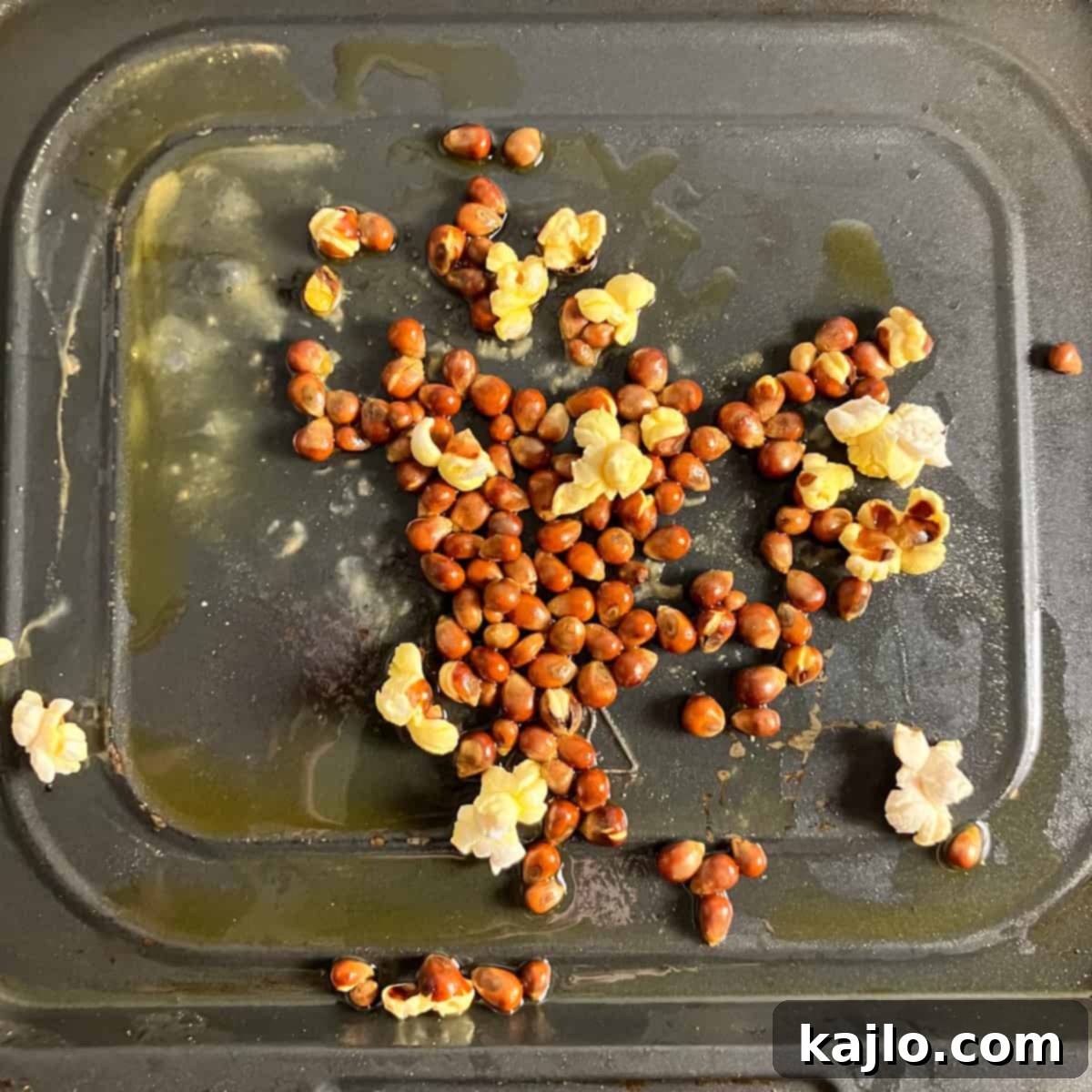 Air Fryer Magic for Microwave Popcorn 5 Burnt microwave popcorn kernels after extended air frying