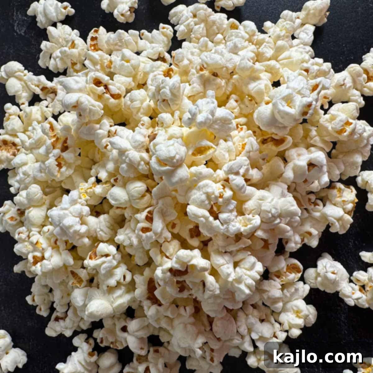 Air Fryer Magic for Microwave Popcorn 7 A bowl of freshly air-fried popcorn, ready for toppings.