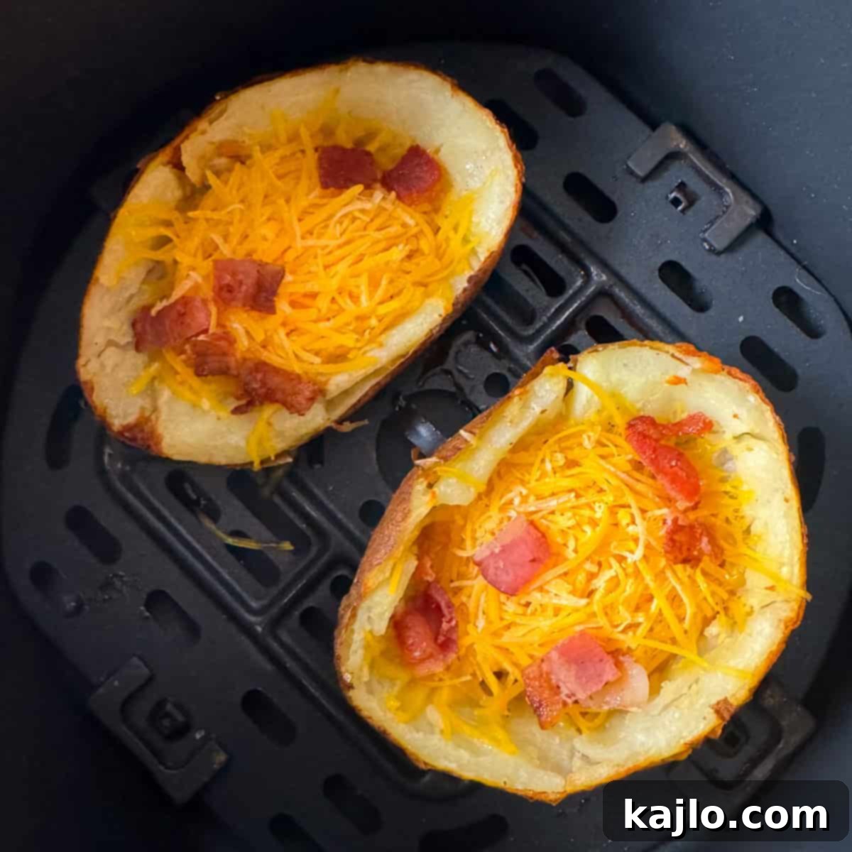 Air fryer loaded potato skins with cheese and bacon melting