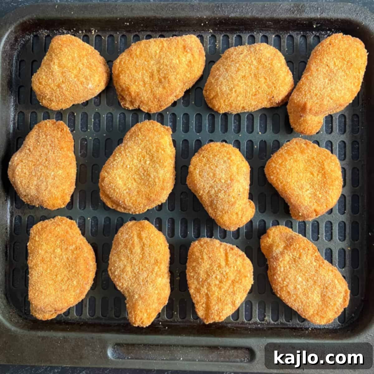 Crispy Air Fryer Chicken Nuggets 3 Frozen chicken nuggets neatly arranged in an air fryer basket