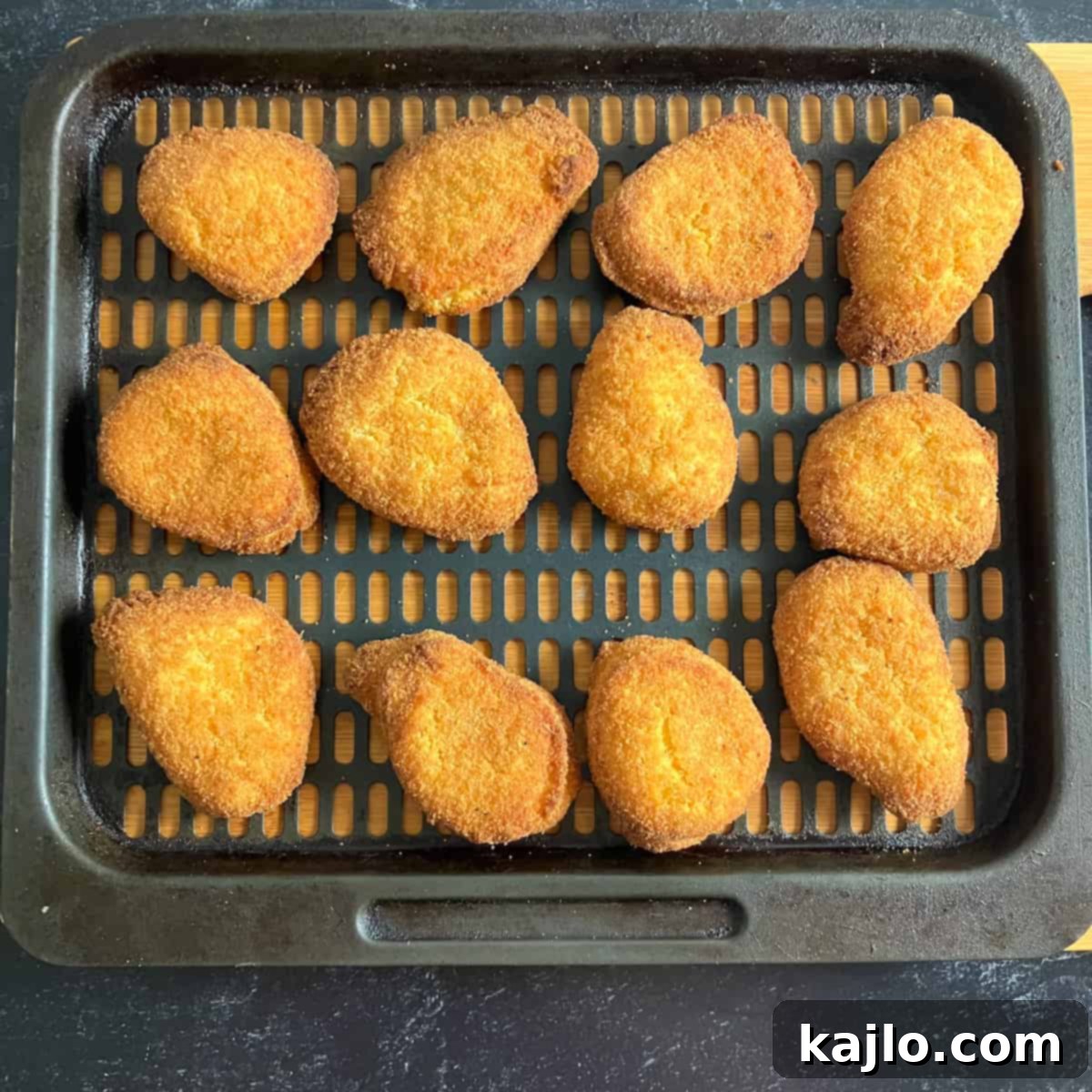 Crispy Air Fryer Chicken Nuggets 4 Crispy, golden-brown chicken nuggets fresh from the air fryer
