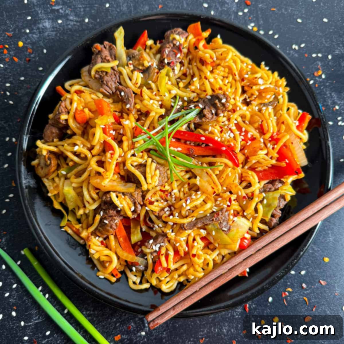 Lightened Up Beef Yakisoba 9 A freshly made, garnished beef yakisoba dish, ready to be served