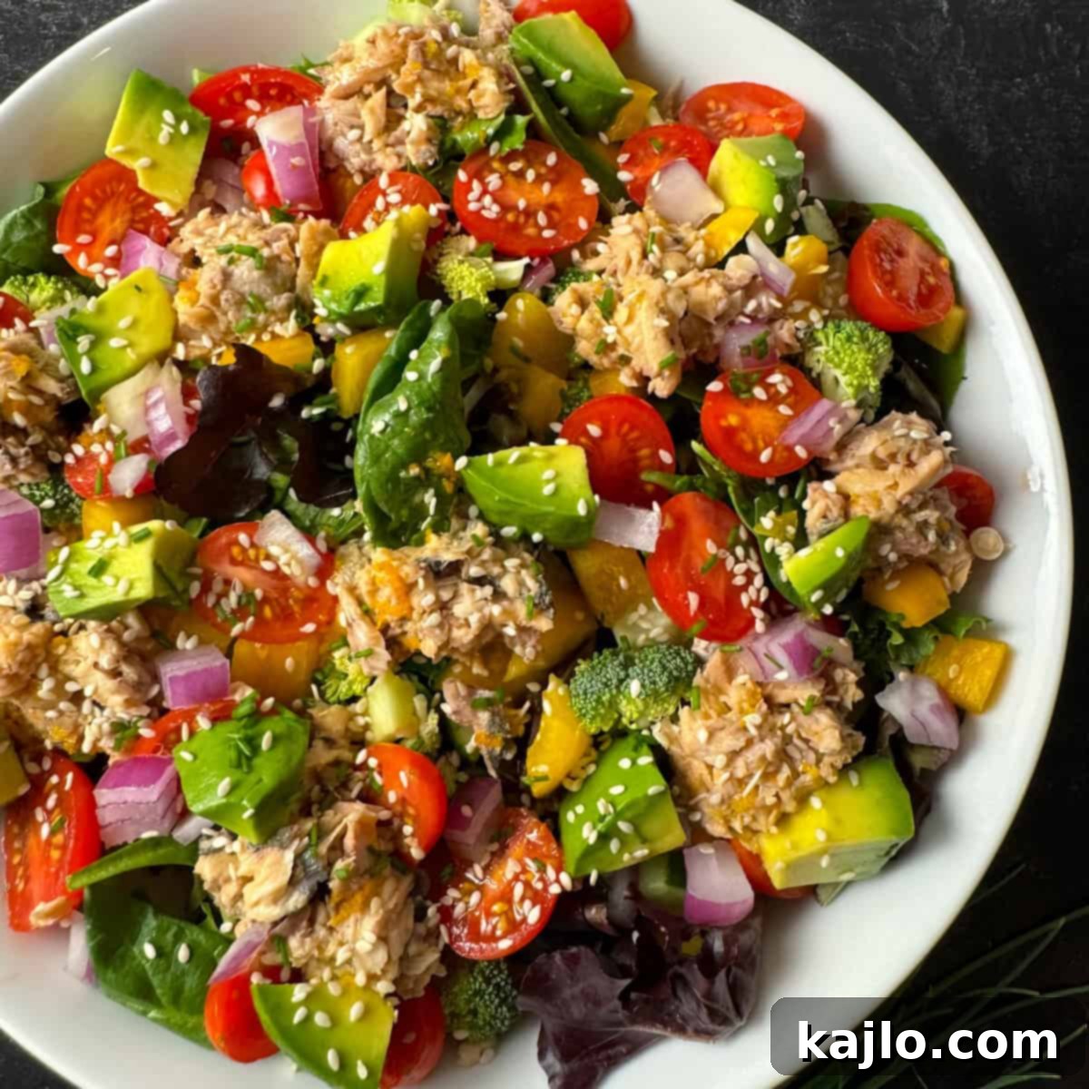 Fresh salad with canned salmon and citrus dressing