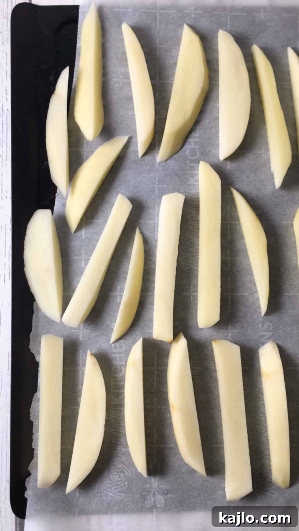 Air Fryer Frozen French Fries: Crispy and Healthy 3 Hand cut potatoes laid out for freezing