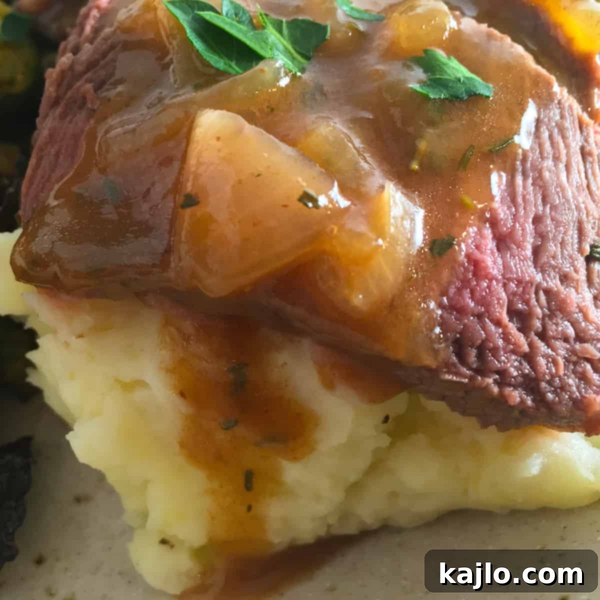 Instant Pot London Broil served with gravy, ready to eat