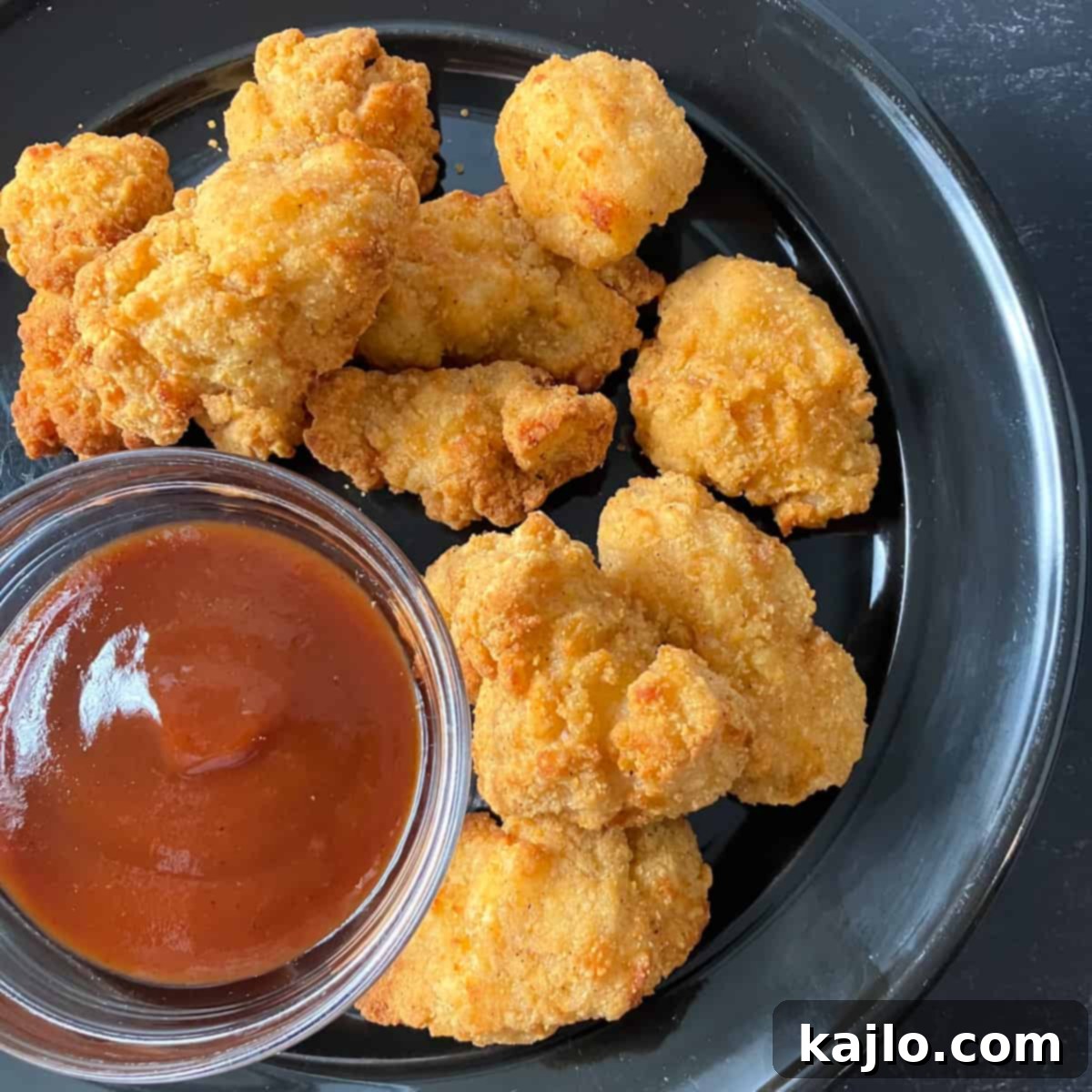 Air-fried Tyson frozen popcorn chicken, golden brown and crispy.