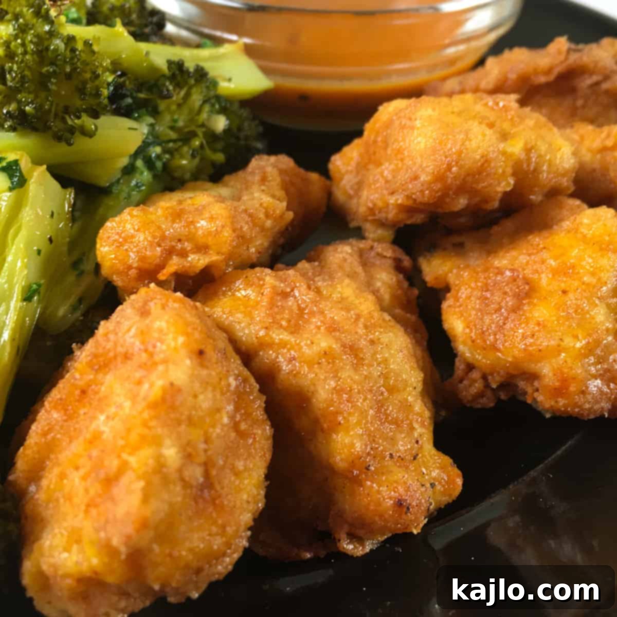 A complete meal featuring air-fried chicken bites with sides.