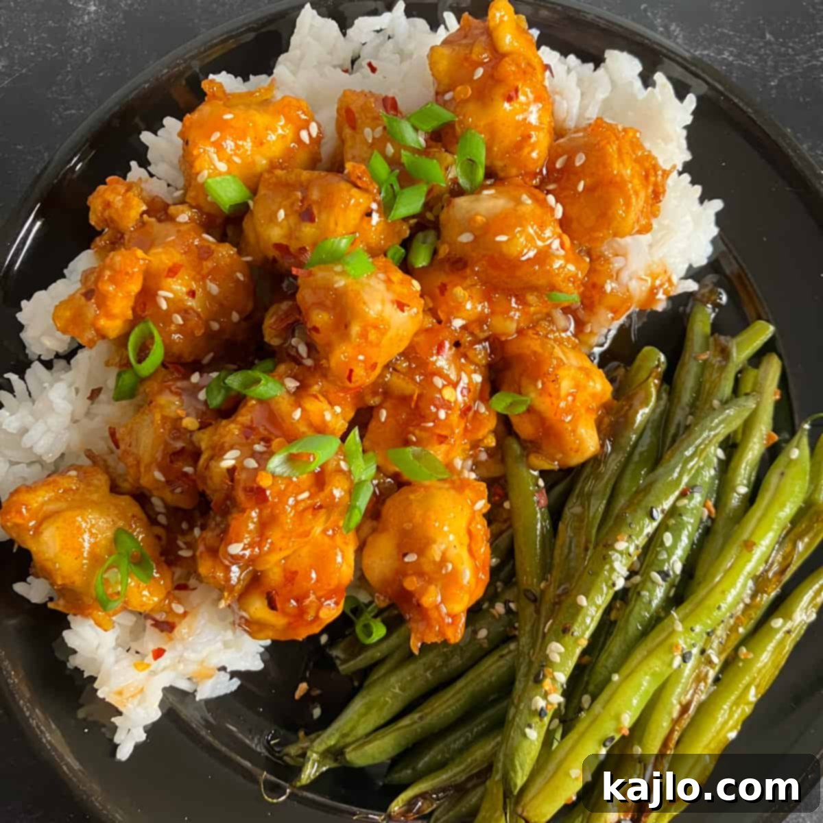 Collection of Air Fryer Chicken dishes, including orange chicken, popcorn chicken, and wings
