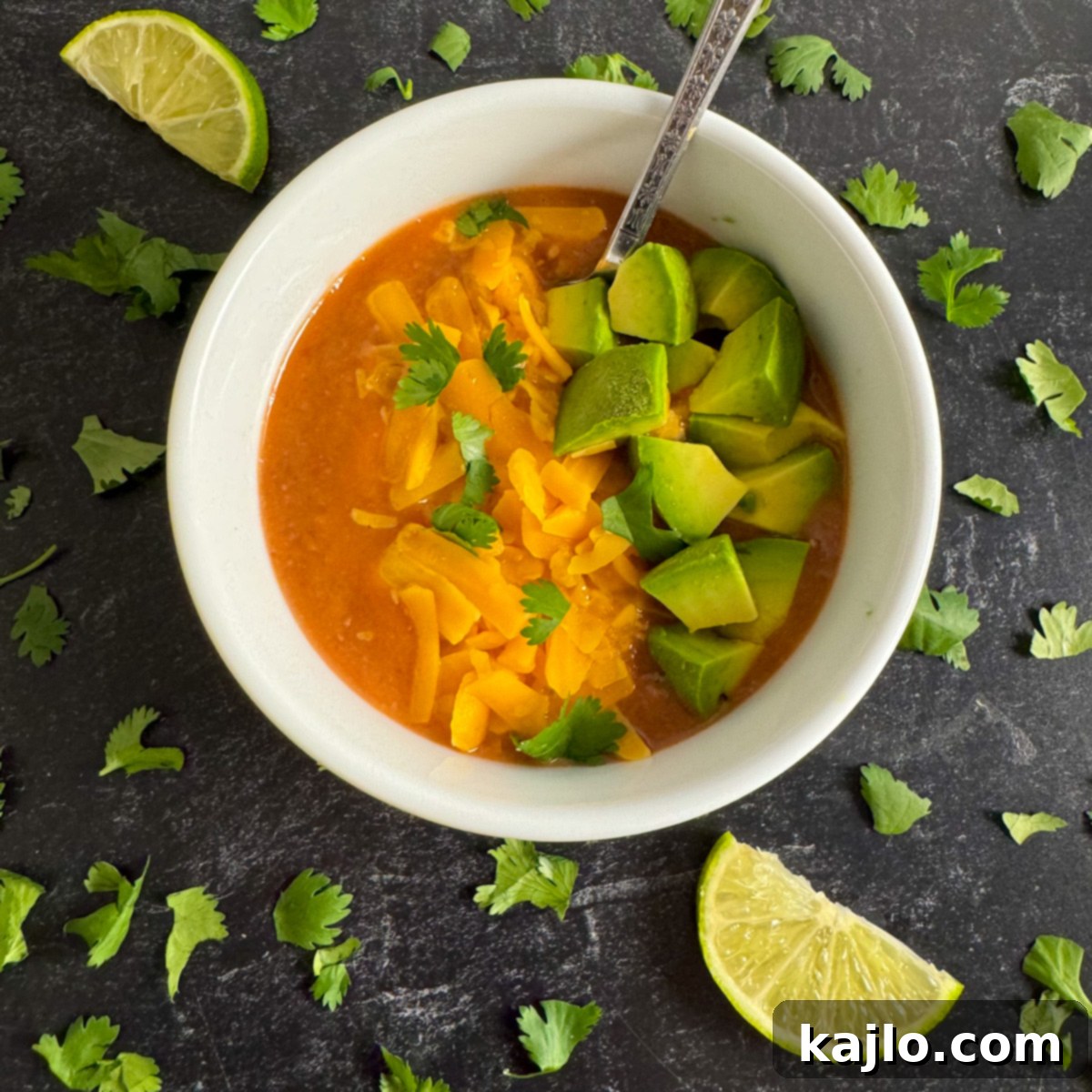 Easy Air Fryer Chili Bean Soup 6 Delicious air fryer bean soup served in a ramekin, topped with shredded cheese, avocado, and cilantro.