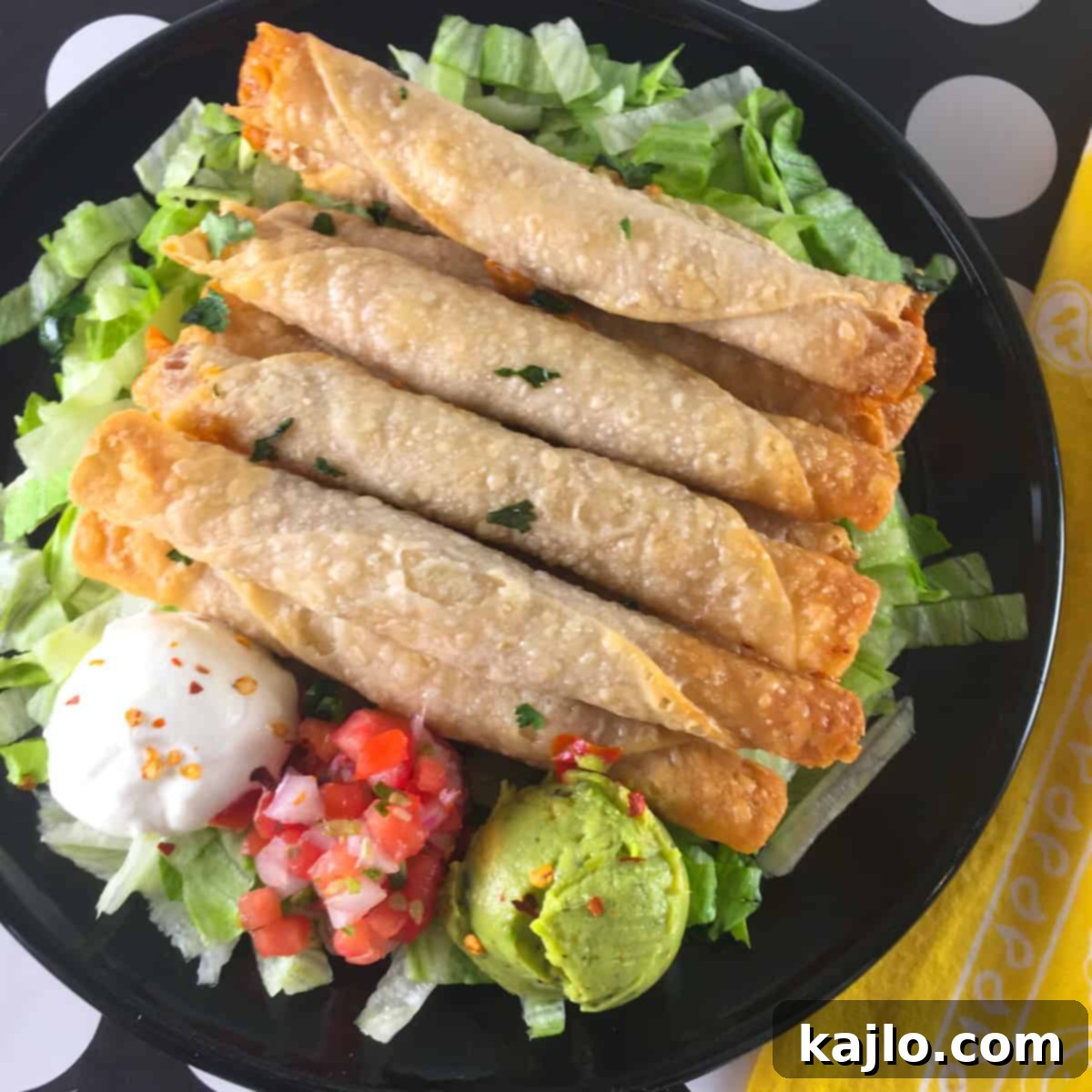 Air Fryer Frozen Flautas: Crispy Perfection in Minutes 2 Crispy air-fried taquitos served with fresh salsa and guacamole