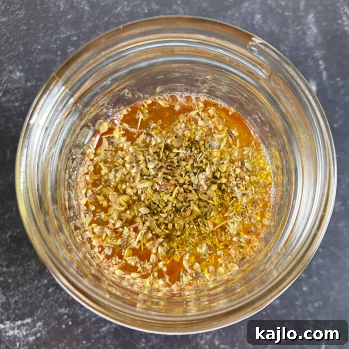 Homemade keto Greek salad dressing in a jar.