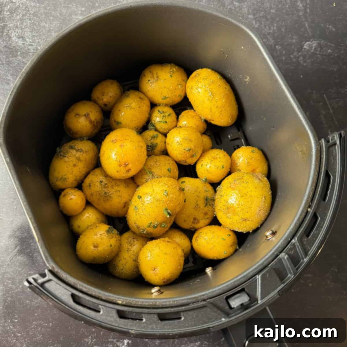 Baby potatoes in air fryer basket