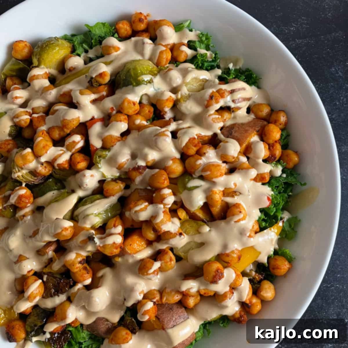 Light Plant-Powered Bowls for Vibrant Health 2 Low calorie nourish bowls featuring roasted vegetables, chickpeas, and a creamy tahini dressing