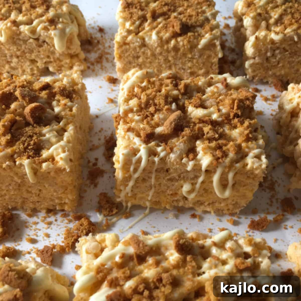 No-Bake Vegan Crispy Treats 10 Autumn-themed pumpkin rice crispy treats with a white chocolate drizzle and crushed ginger snaps.