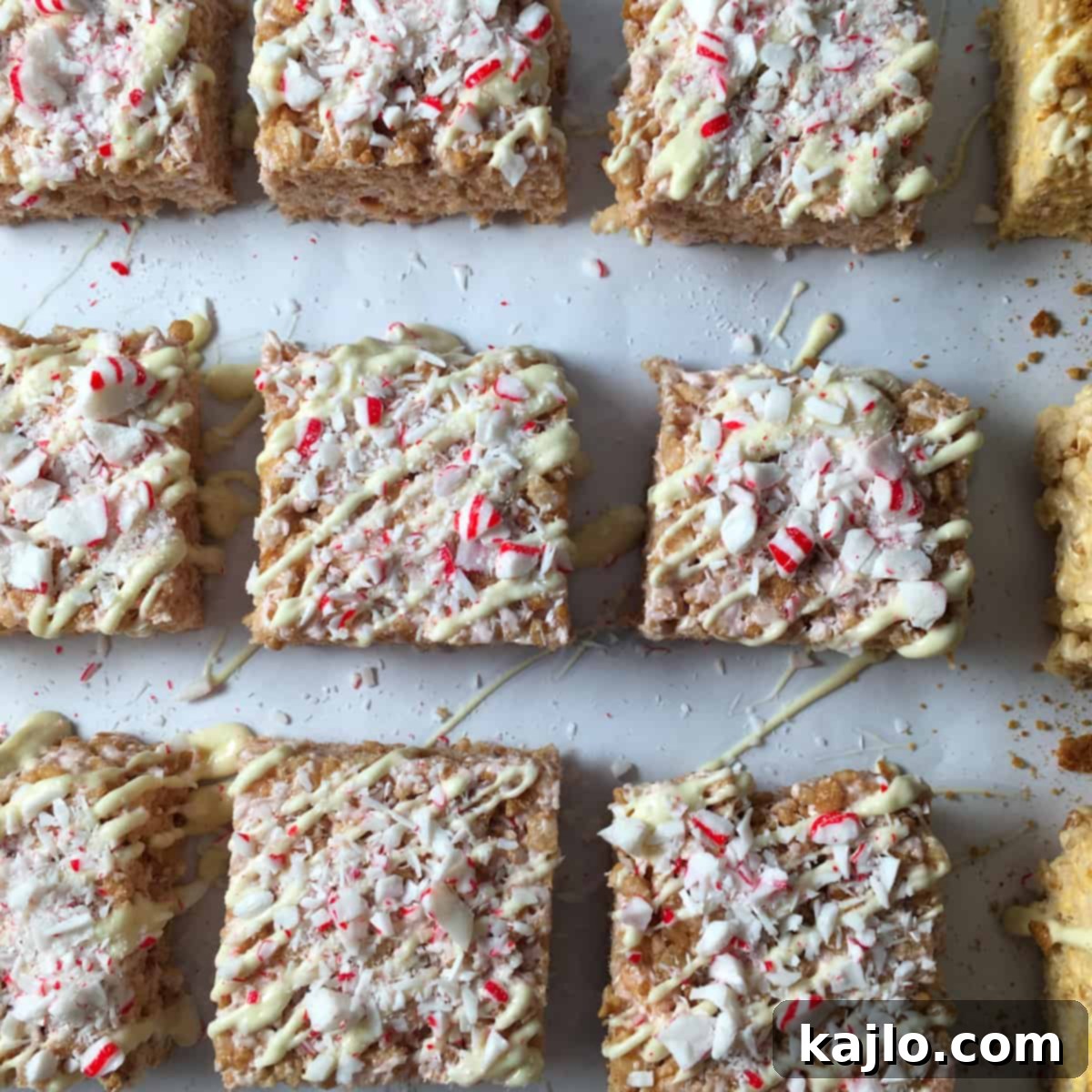 No-Bake Vegan Crispy Treats 15 Beautifully arranged peppermint rice crispy treats with chocolate drizzle, perfect for a festive occasion.