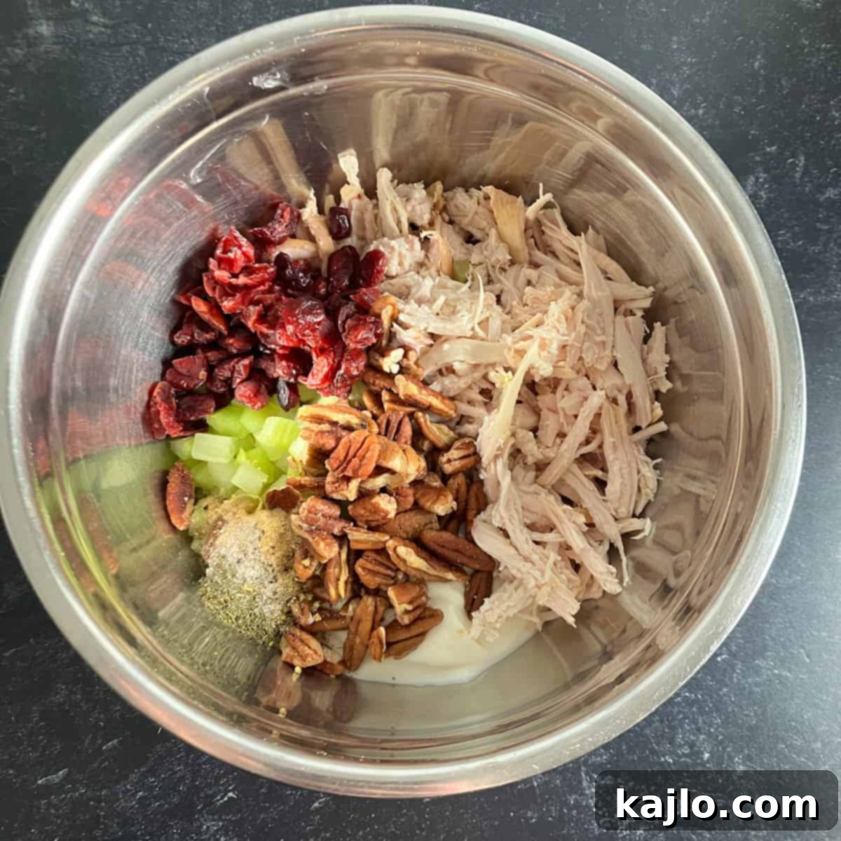 a bowl of mixed turkey salad ingredients before final stir