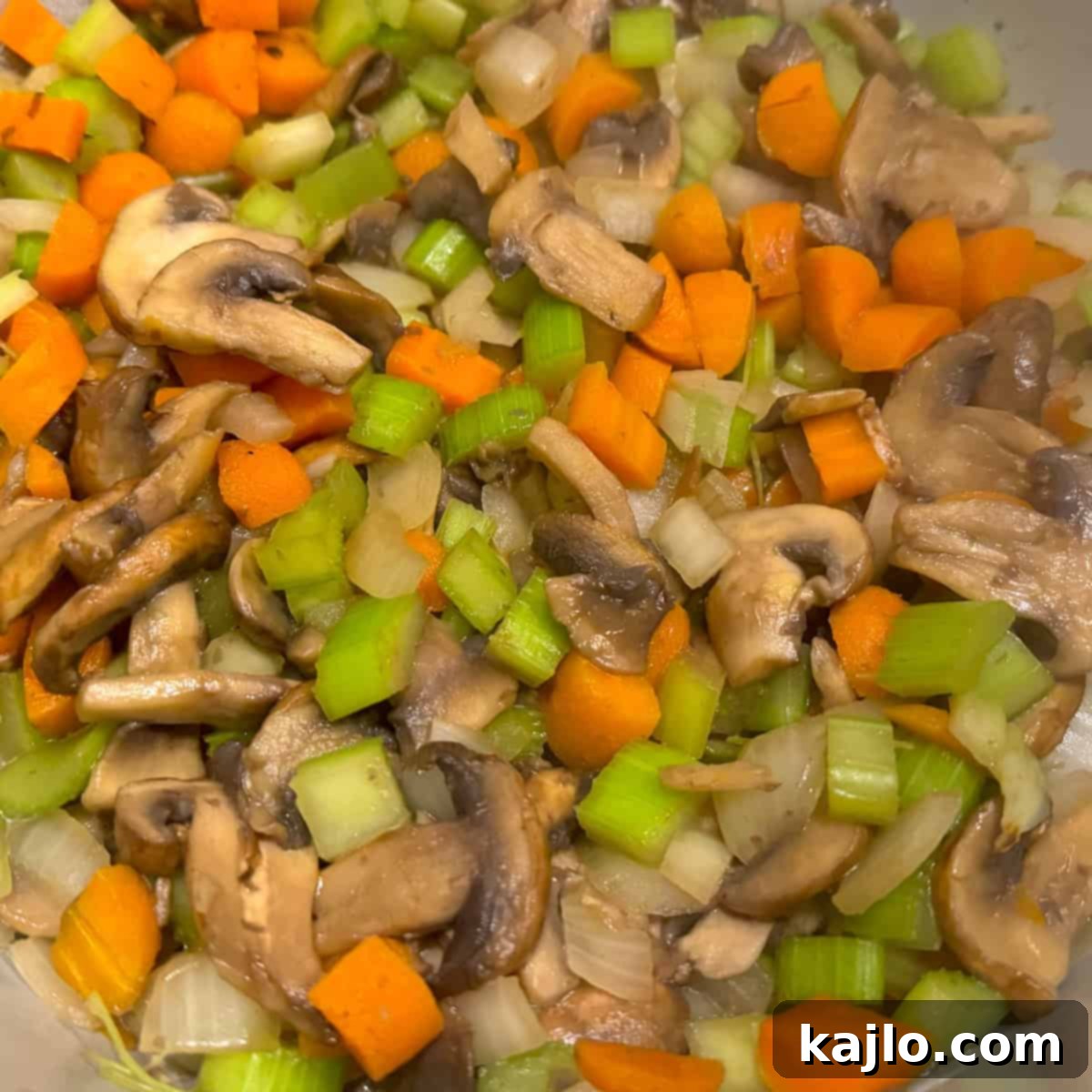 Instant Pot and Slow Cooker Turkey Wild Rice Soup 4 Vegetables sautƩing in an Instant Pot for turkey rice soup.