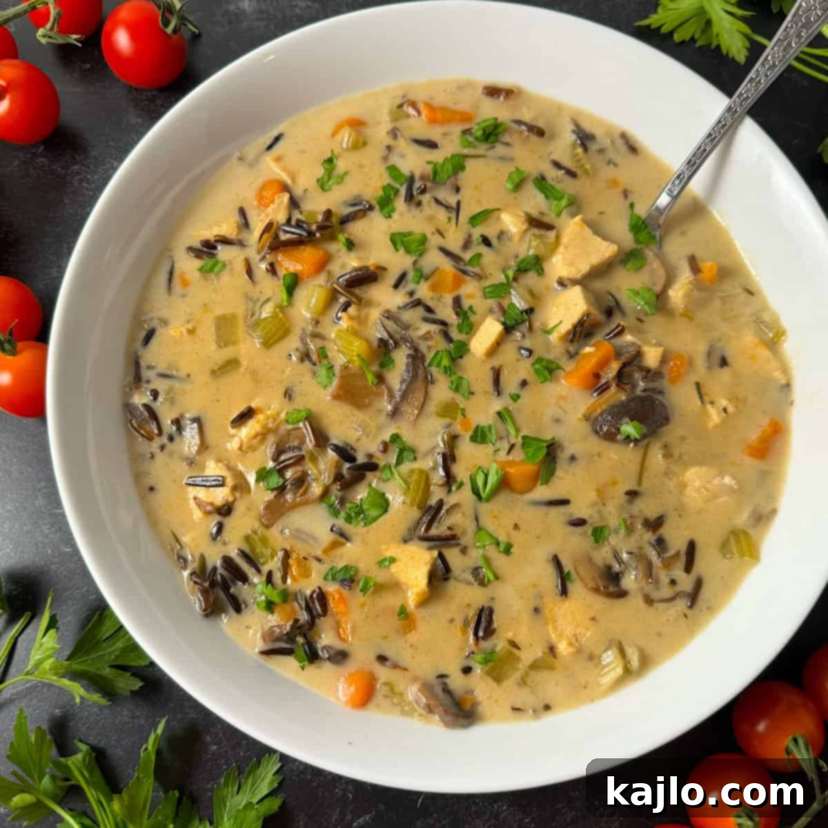 Instant Pot and Slow Cooker Turkey Wild Rice Soup 9 A serving of creamy chicken wild rice soup in a bowl.