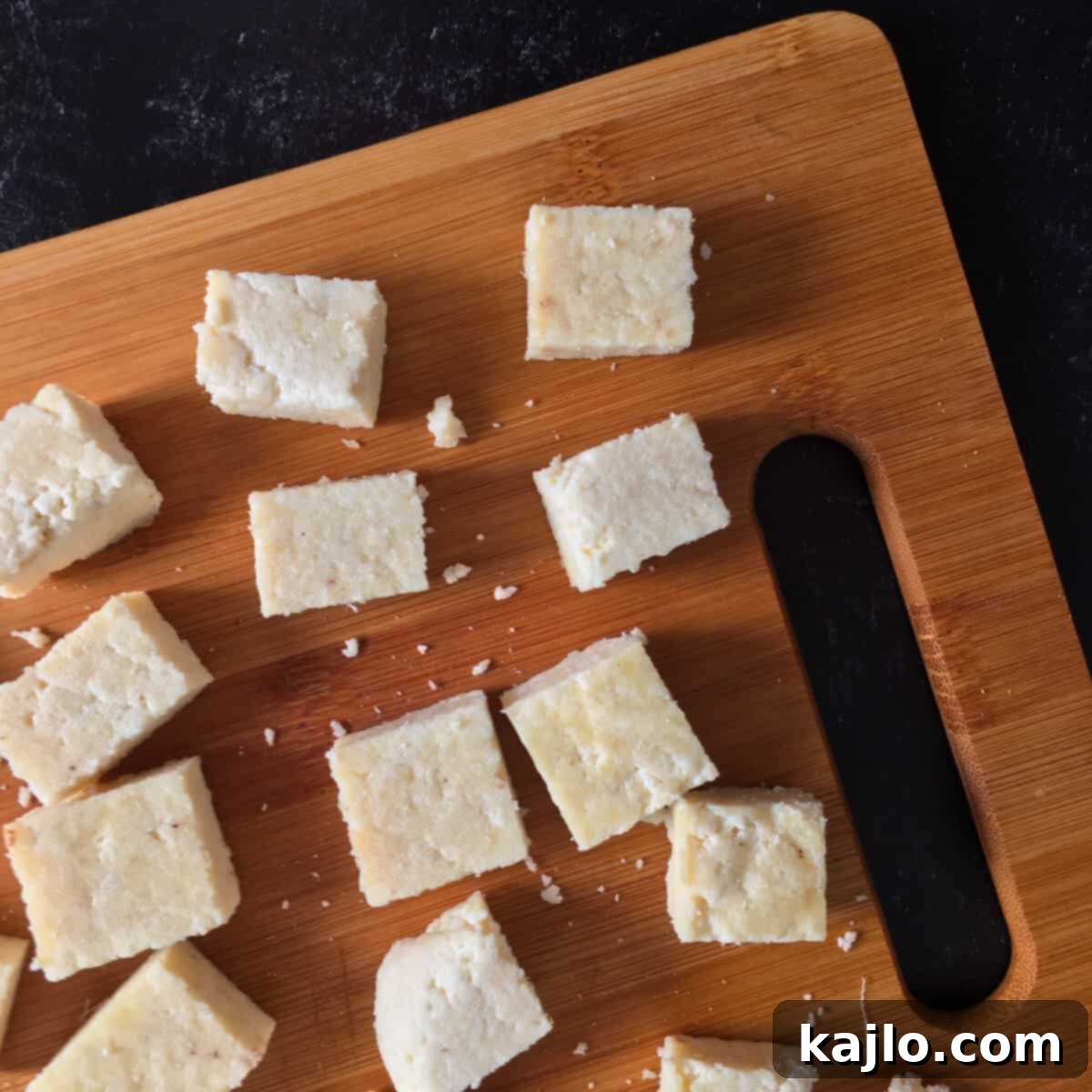Easy Instant Pot Paneer 7 A block of paneer resting on cheesecloth, ready to be pressed.