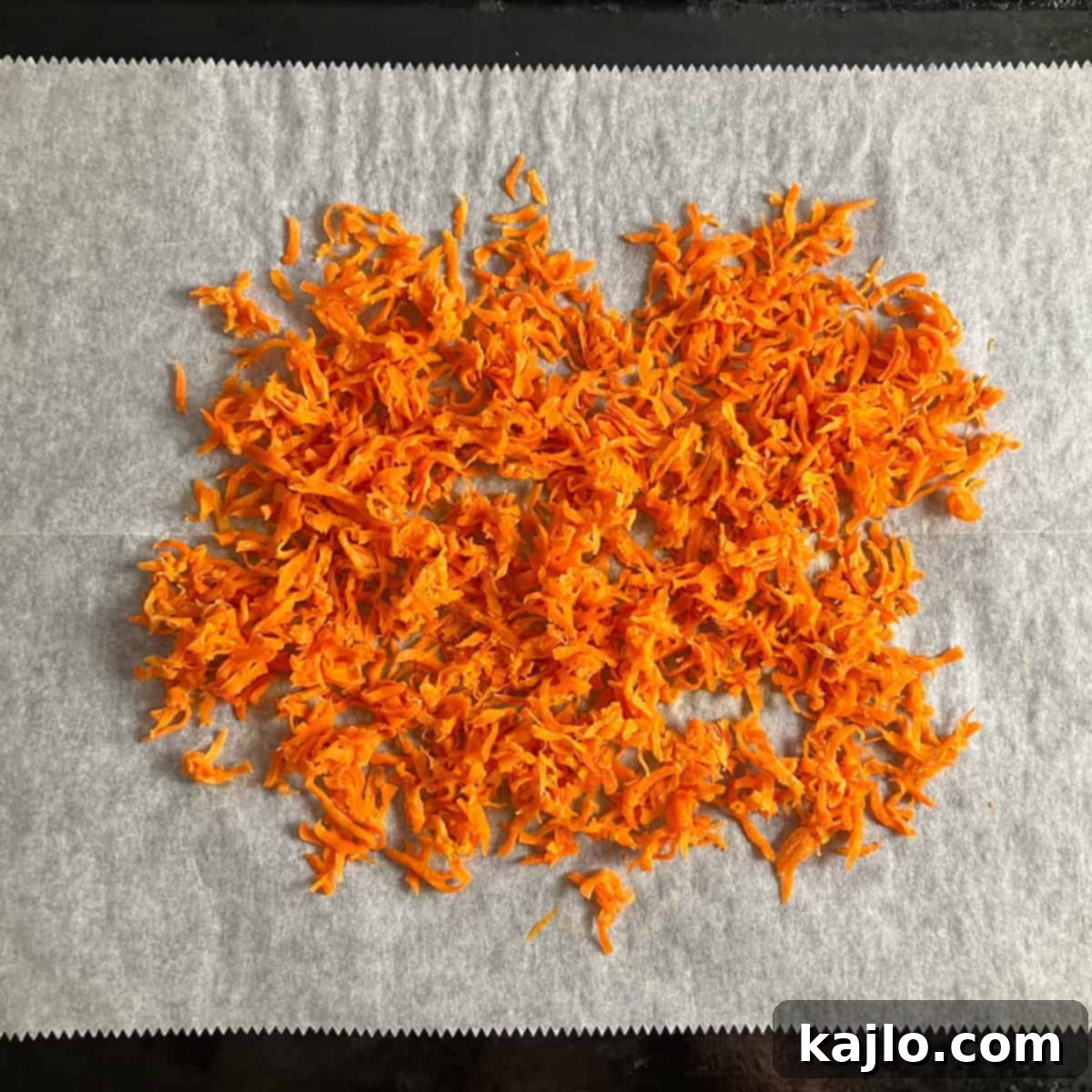Candied carrots spread on a baking sheet