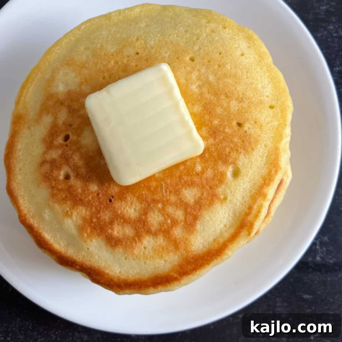 Close-up of fluffy pancakes, Denny's style.