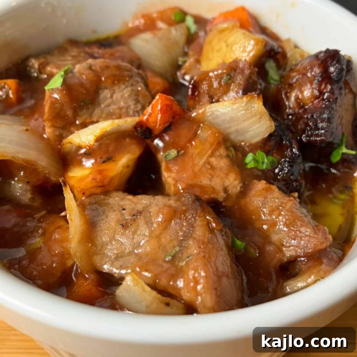 Delicious air fryer beef stew in a serving pot, garnished and ready.