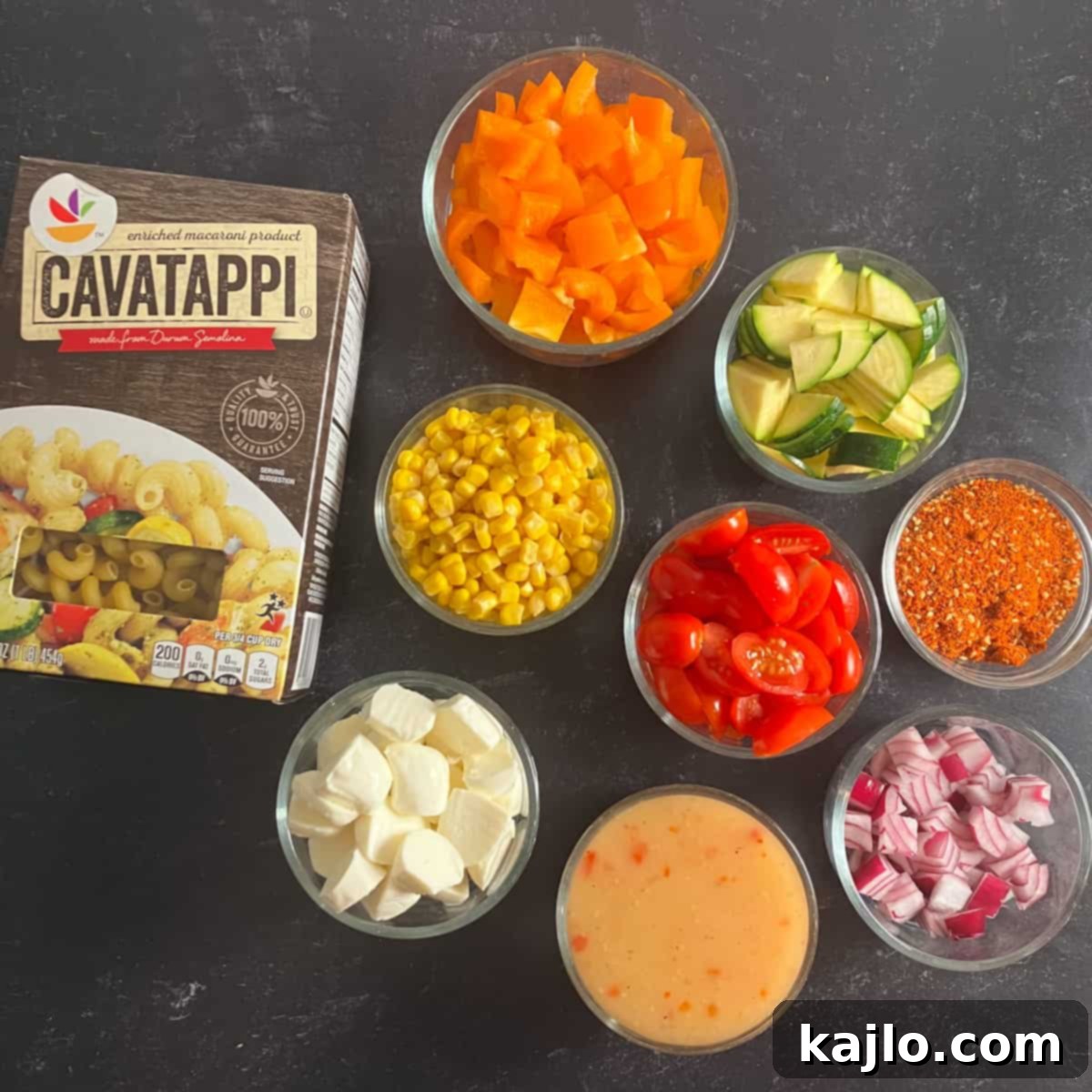 McCormick Salad Supreme Pasta Salad 4 All the fresh and vibrant ingredients laid out for making the Salad Supreme Pasta Salad.