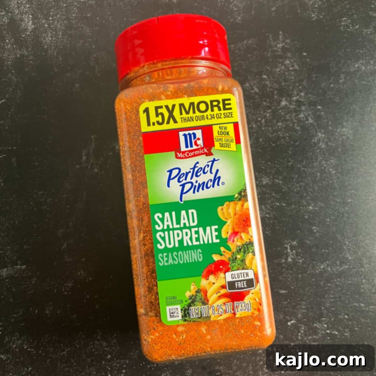 McCormick Salad Supreme Pasta Salad 5 A container of McCormick Salad Supreme seasoning, the key to the pasta salad's distinctive flavor.