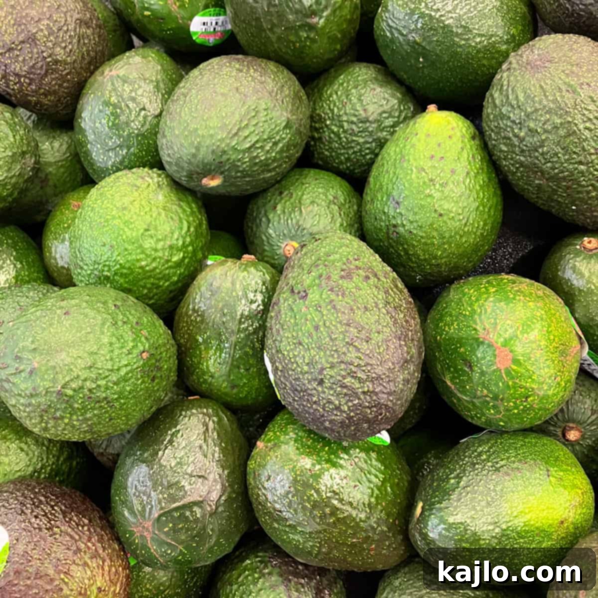 Spotty Avocado: Is It Still Good to Eat 4 Close-up of a Hass avocado skin with a few brown spots, illustrating normal ripening blemishes.