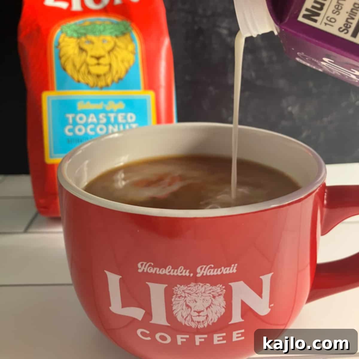 Hawaii's Top Coffee Brands: A Hawaii Coffee Company Spotlight 4 A cup of freshly brewed Hawaiian coffee with steam rising, next to coffee beans and a bag of coffee.