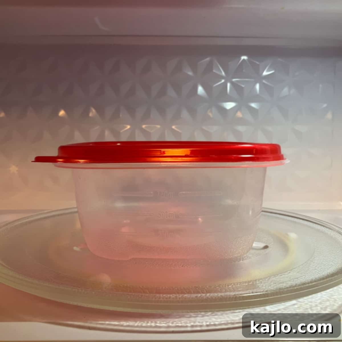 Can You Microwave Tupperware The Facts on Plastic Safety 4 Person placing a Tupperware container into a microwave