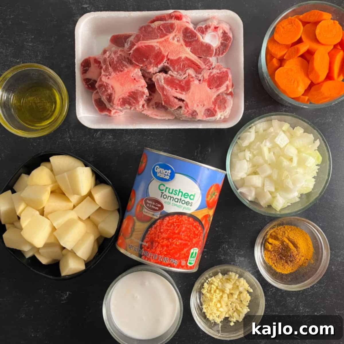 Assortment of fresh ingredients for a curry oxtail recipe