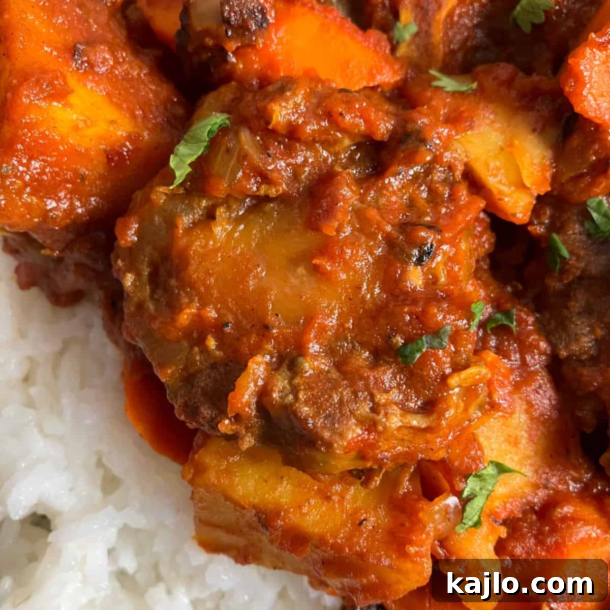 Delicious oxtail curry with rice and greens