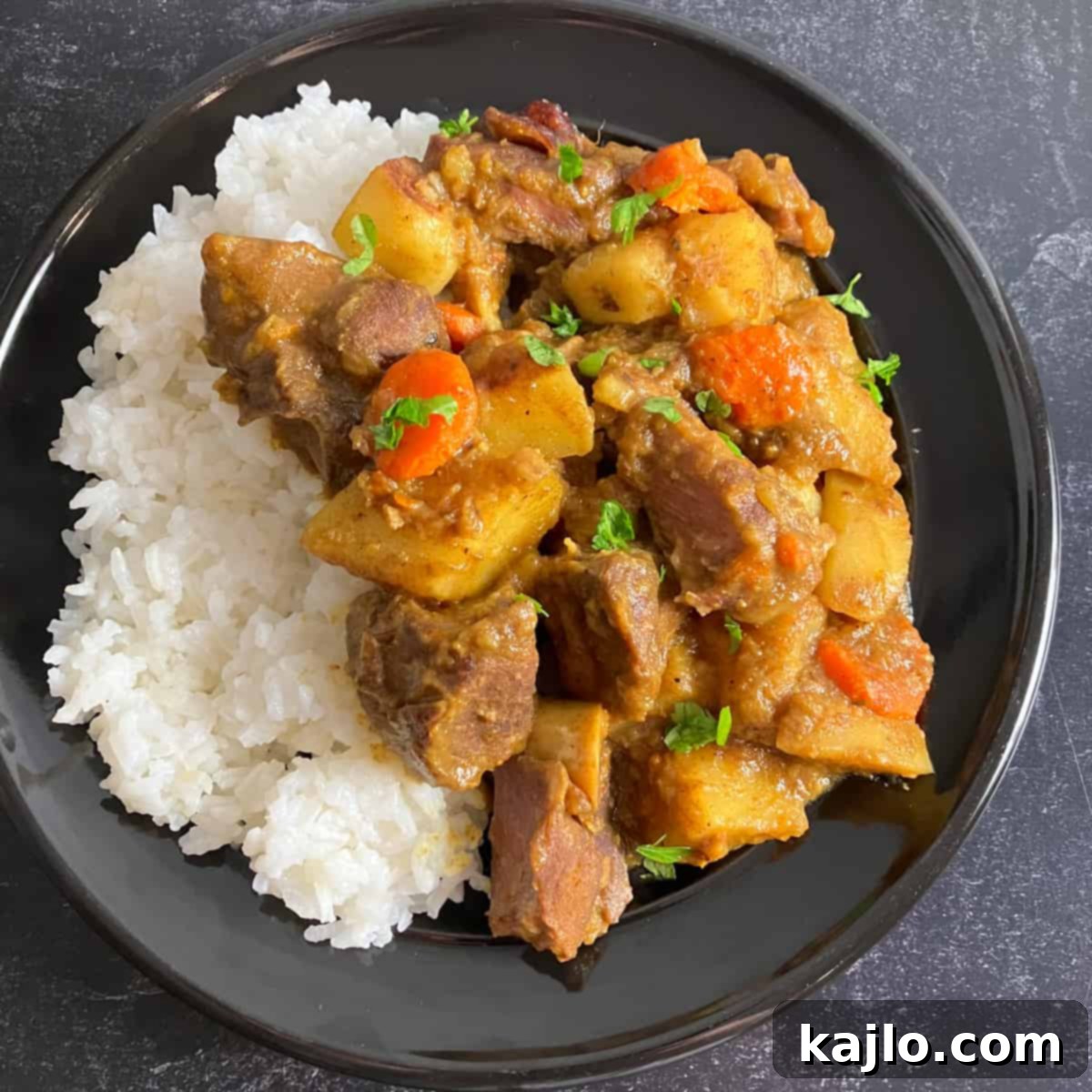 Goat Meat Your Complete Guide to Recipes Sourcing and Health Benefits 6 A close-up shot of the finished curried goat dish, showcasing its rich texture and appetizing appeal.