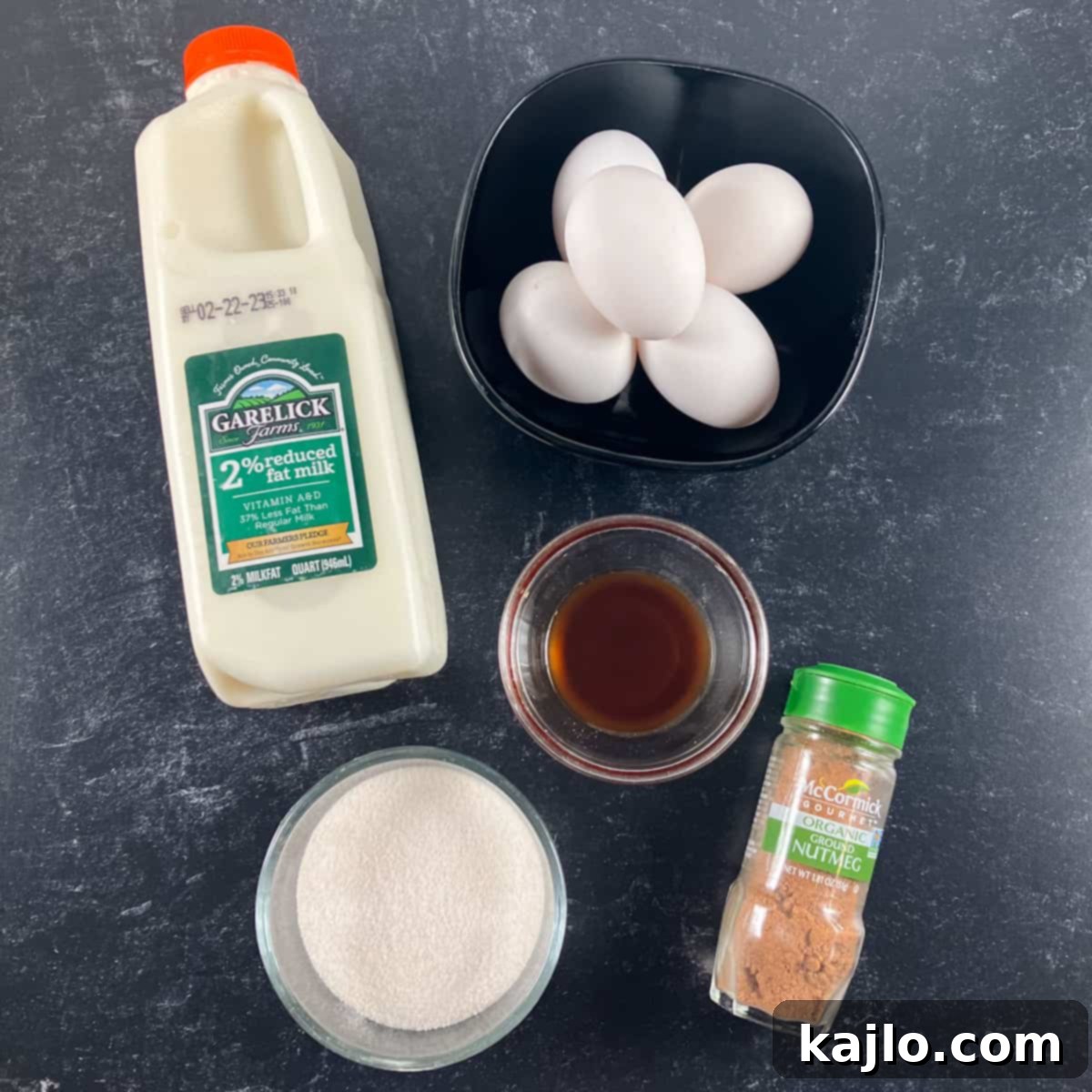 Fresh ingredients for sugar-free custard, including eggs, milk, Swerve sweetener, and vanilla extract