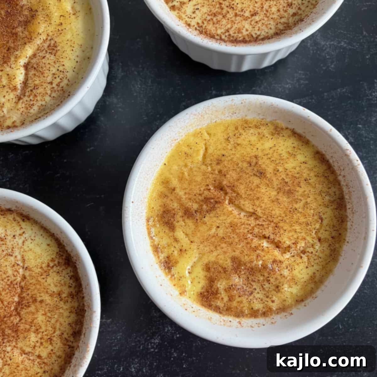 Freshly baked sugar-free custard in ramekins, garnished with nutmeg