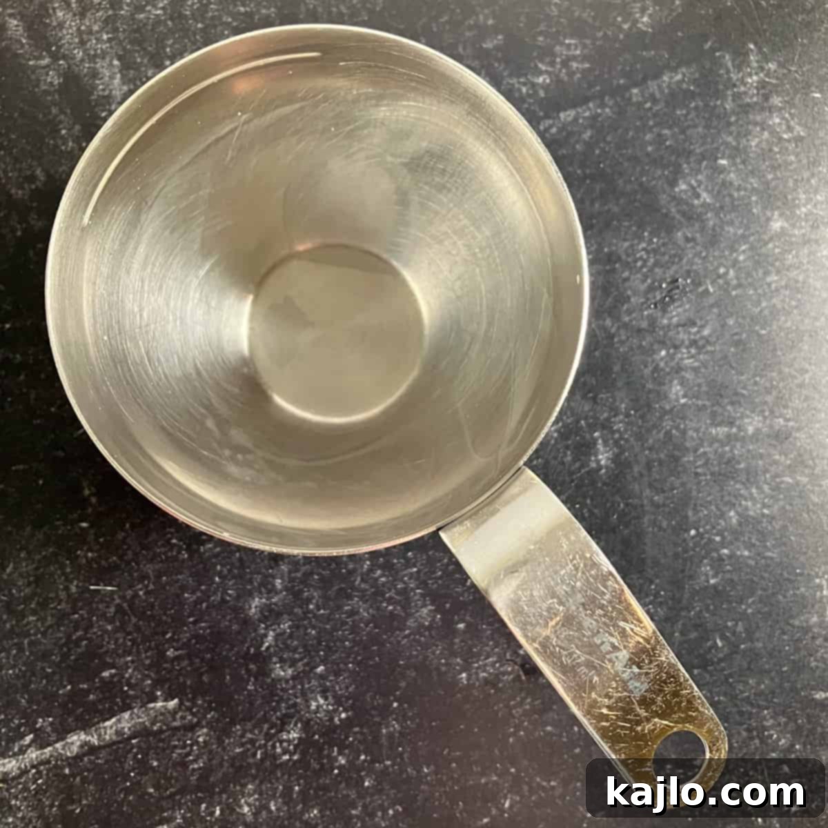 Half a Three-Quarter Cup 2 Visual representation of half of 3/4 cup in a measuring cup