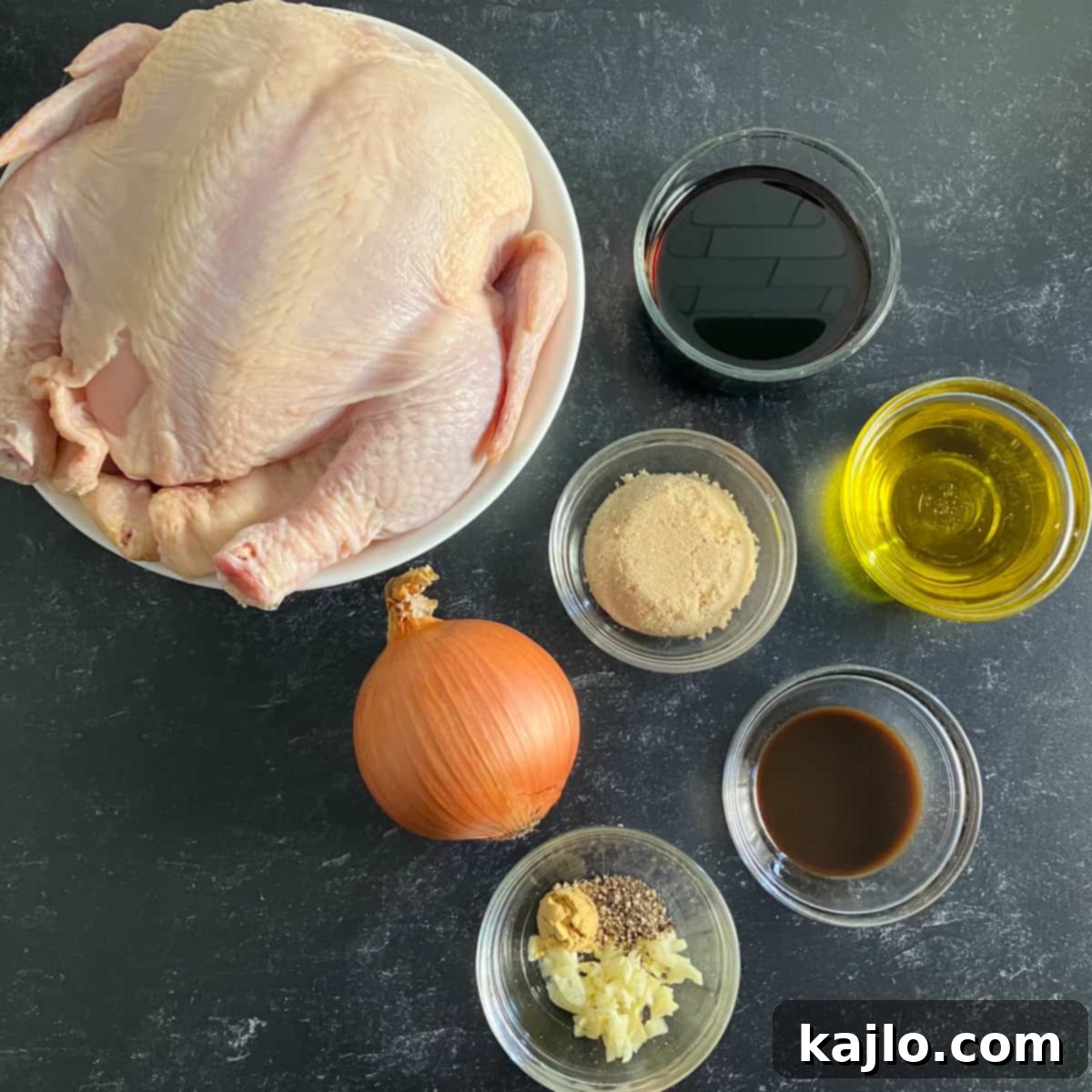 Ultimate Whole Roast Chicken Marinade 3 Assortment of fresh ingredients for roast chicken marinade including garlic, soy sauce, brown sugar, olive oil, and spices.
