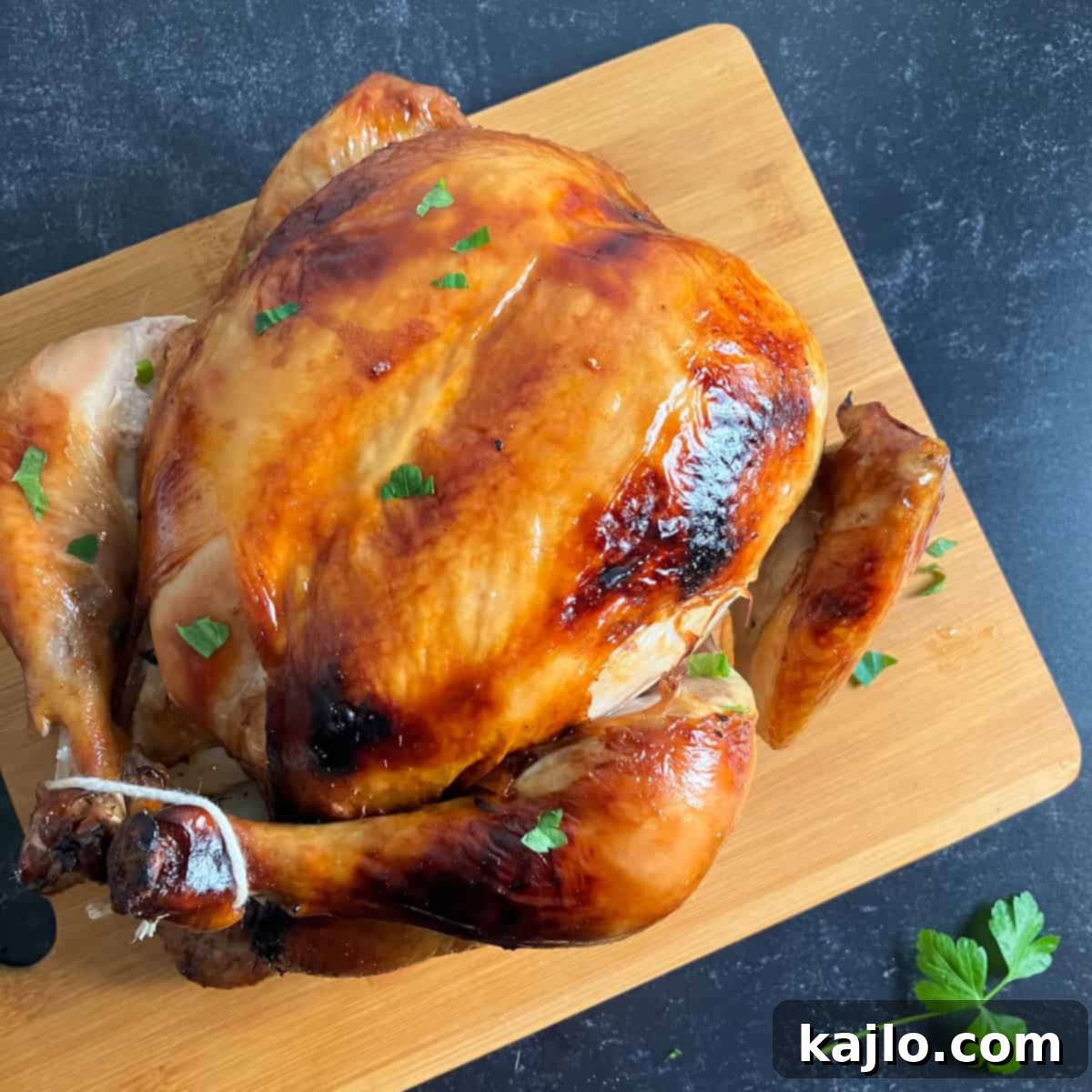 Ultimate Whole Roast Chicken Marinade 5 Carved roast chicken with crispy skin on a cutting board, ready to serve.