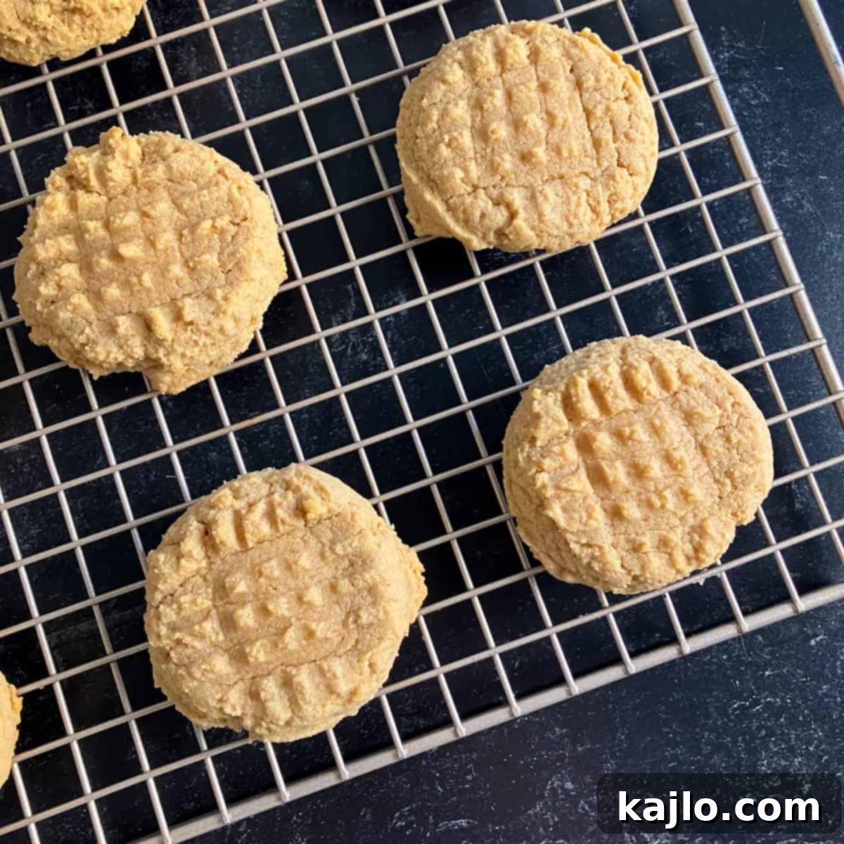 Freshly baked Kodiak peanut butter cookies on a cooling rack