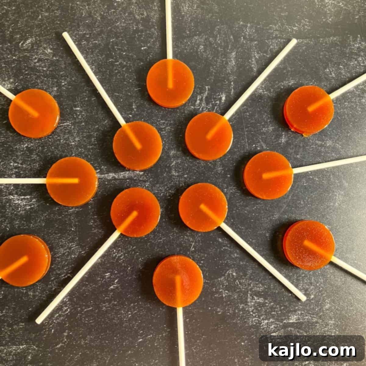 Soothing Honey Lollipops for Coughs and Tea 4 Close-up of golden honey pops, showcasing their inviting texture and color.