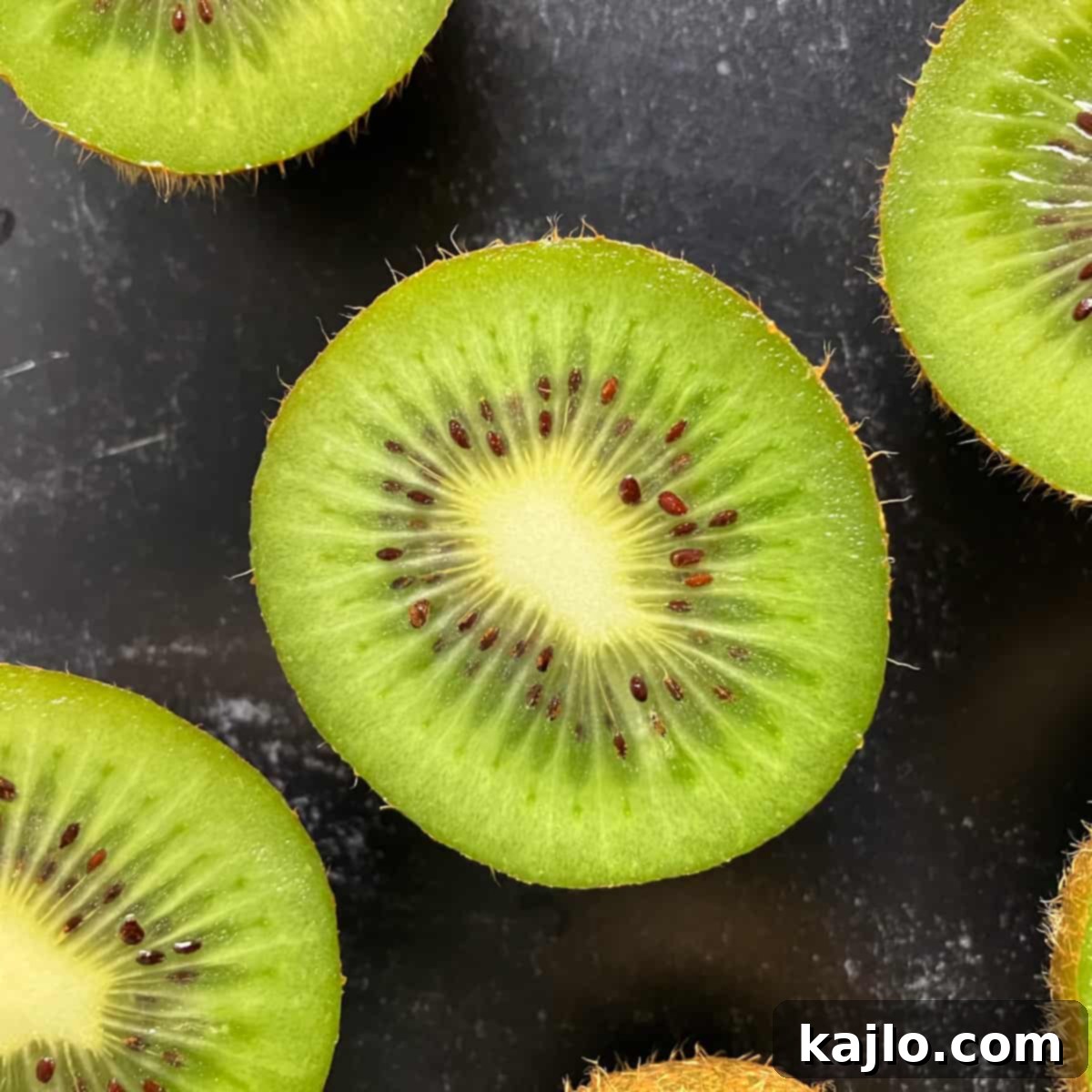 Kiwi Citrus or Not 2 Are kiwi citrus fruit? A vibrant green kiwi fruit slice.