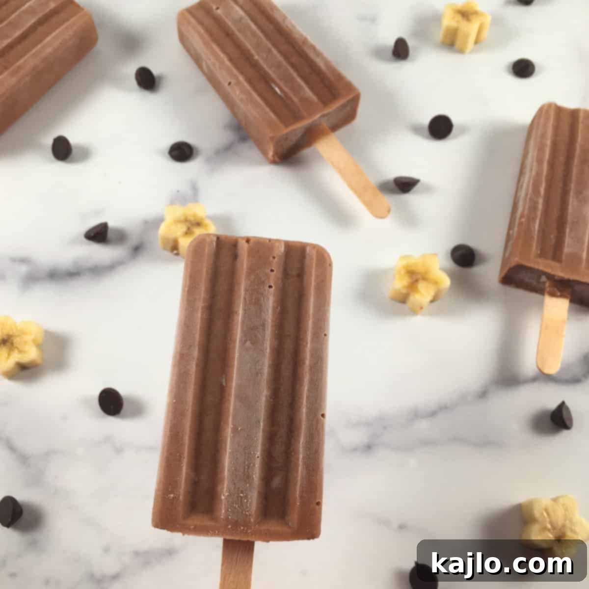 Sugar-Free Vegan Banana Popsicles 8 A selection of sugar free chocolate banana pops, some with sprinkles.