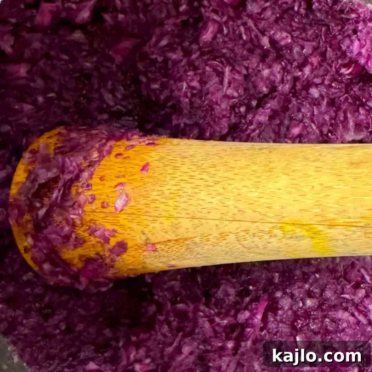 Pounding cabbage to release brine