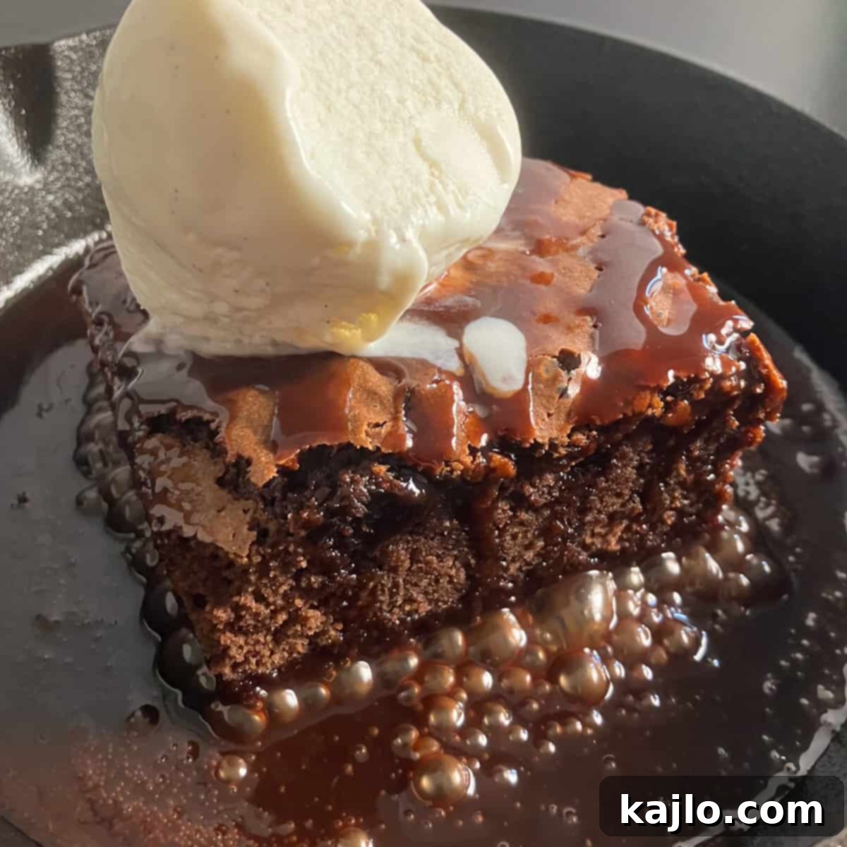 sizzling brownie with ice cream and chocolate sauce being served