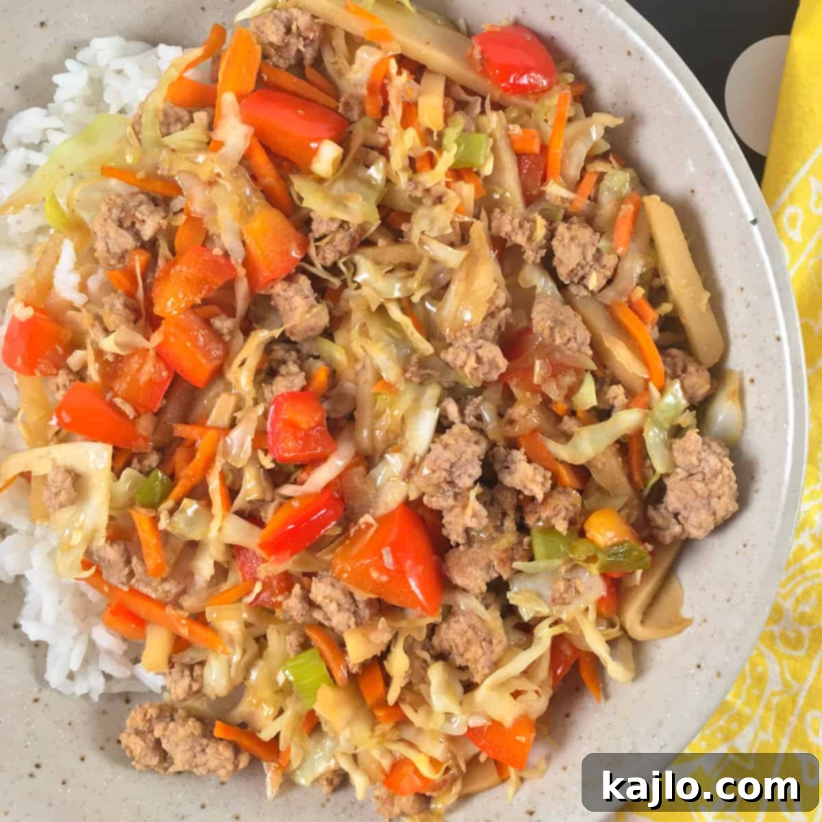 Inside Out Egg Roll Recipe Video 4 Close-up view of the savory pork and cabbage mixture simmering in a large pan