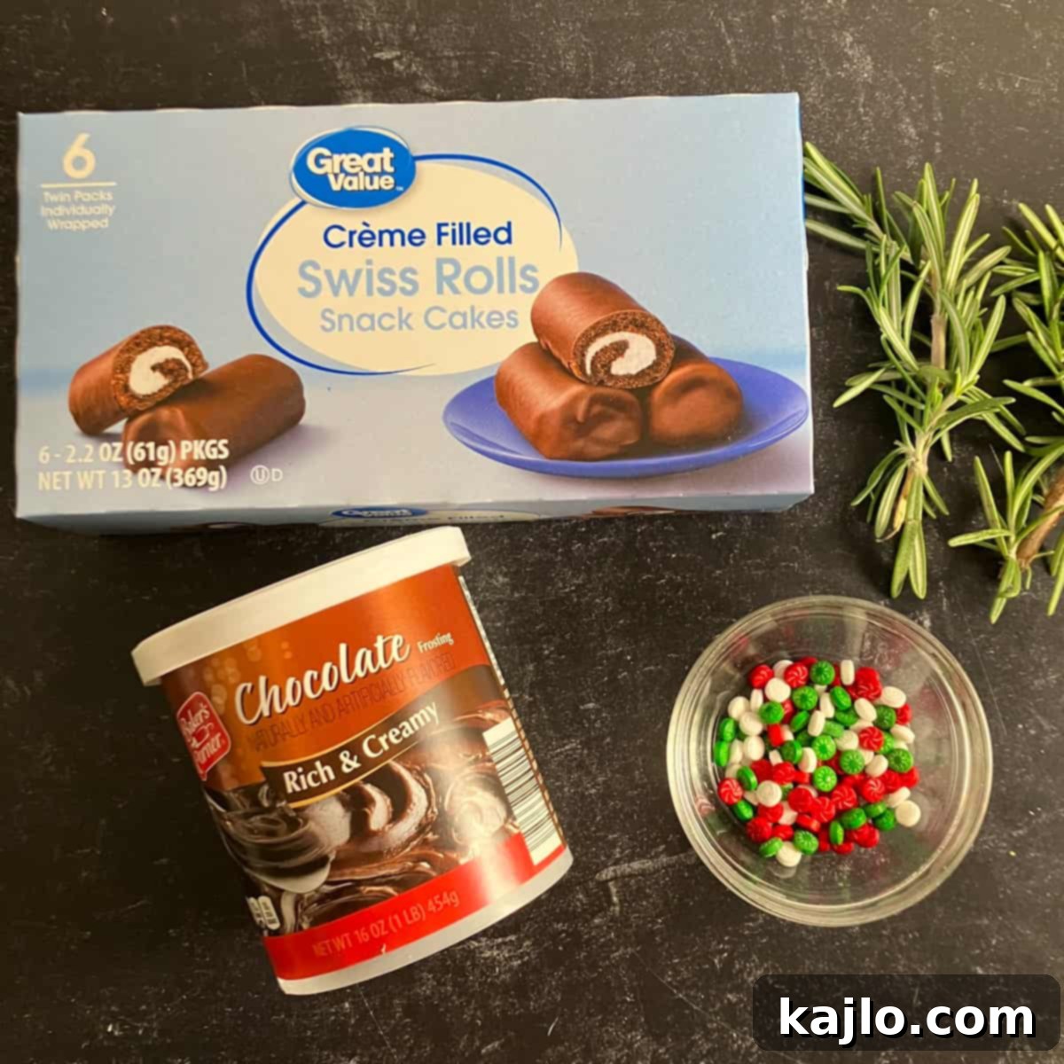 Ingredients for a no-bake Yule log: Swiss rolls, chocolate frosting, and decorations.