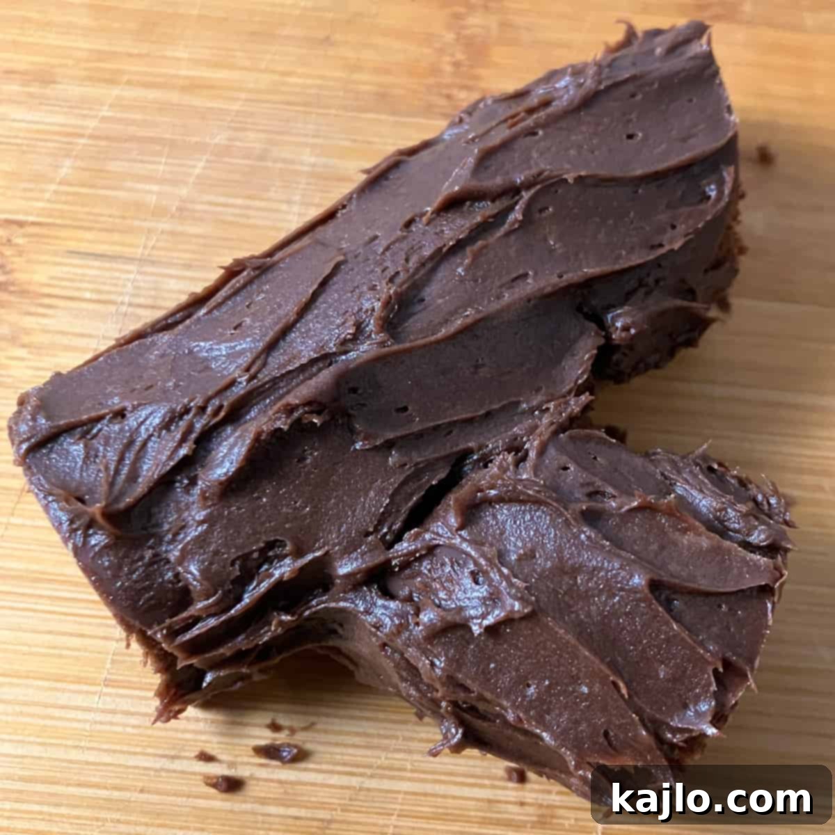 Frosting the Summer Yule log with chocolate to create a bark texture.