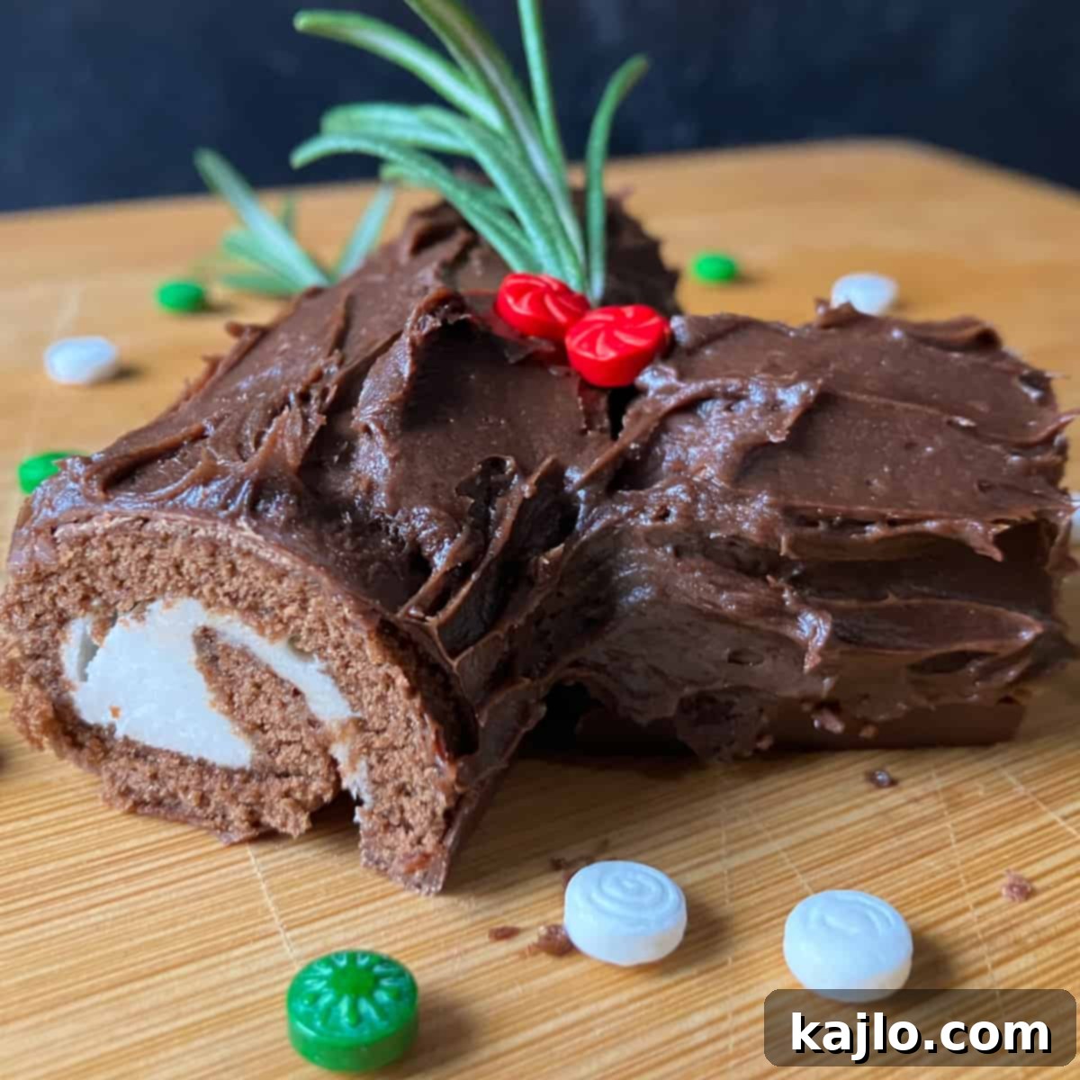 Beautifully decorated Yule log cake on a festive table.
