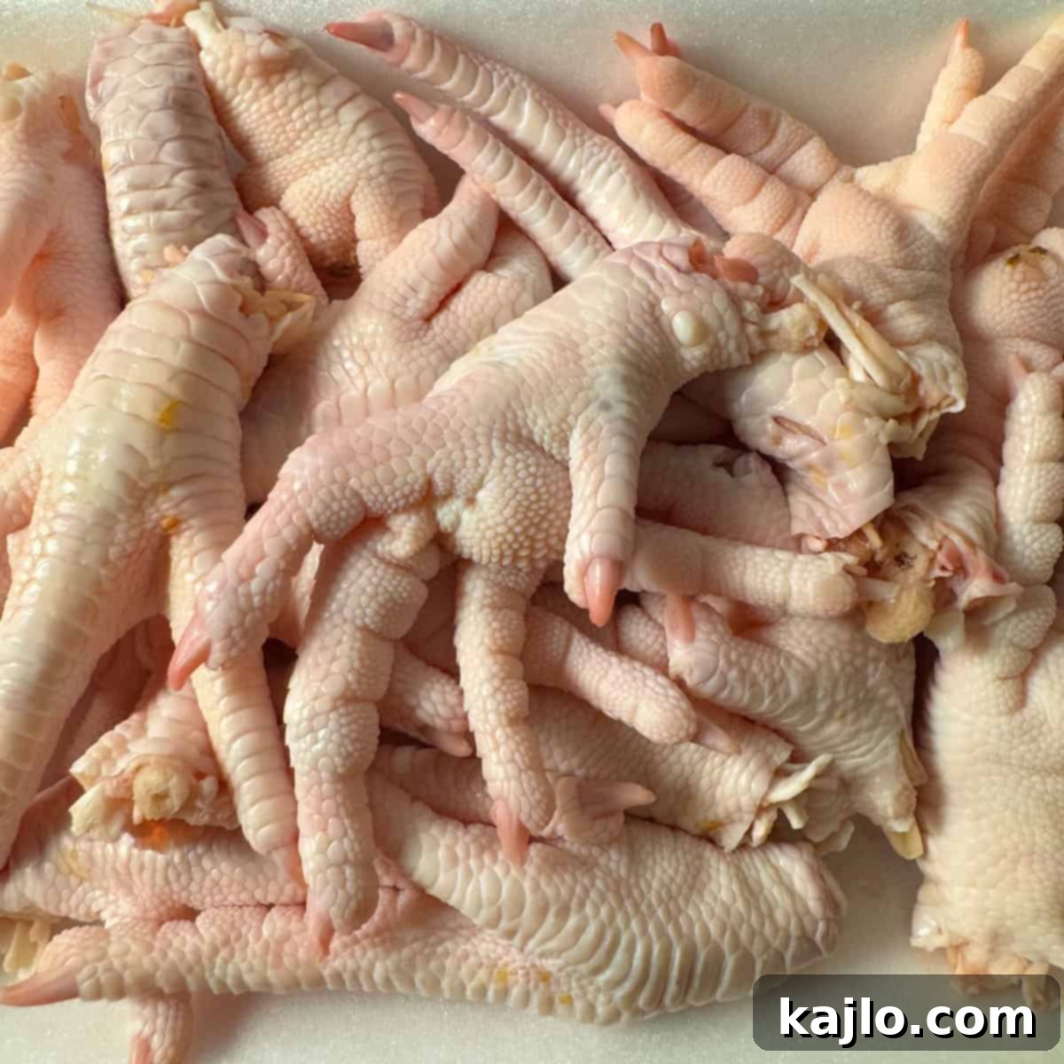 Fresh chicken feet for soup preparation